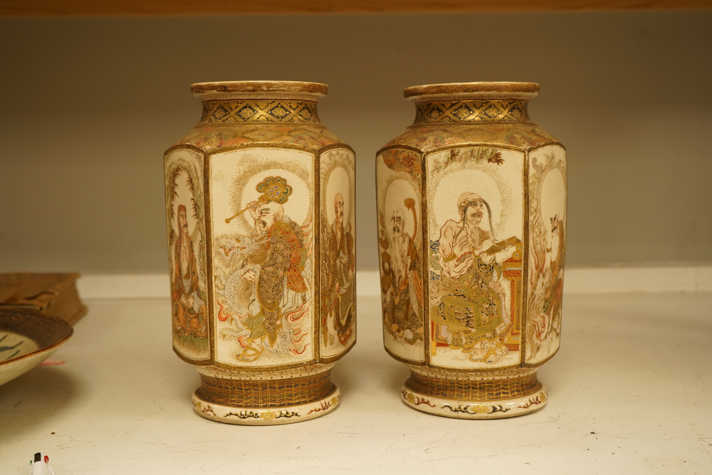 A pair of Japanese Satsuma 'rakan' vases, Meiji period, 26cm high